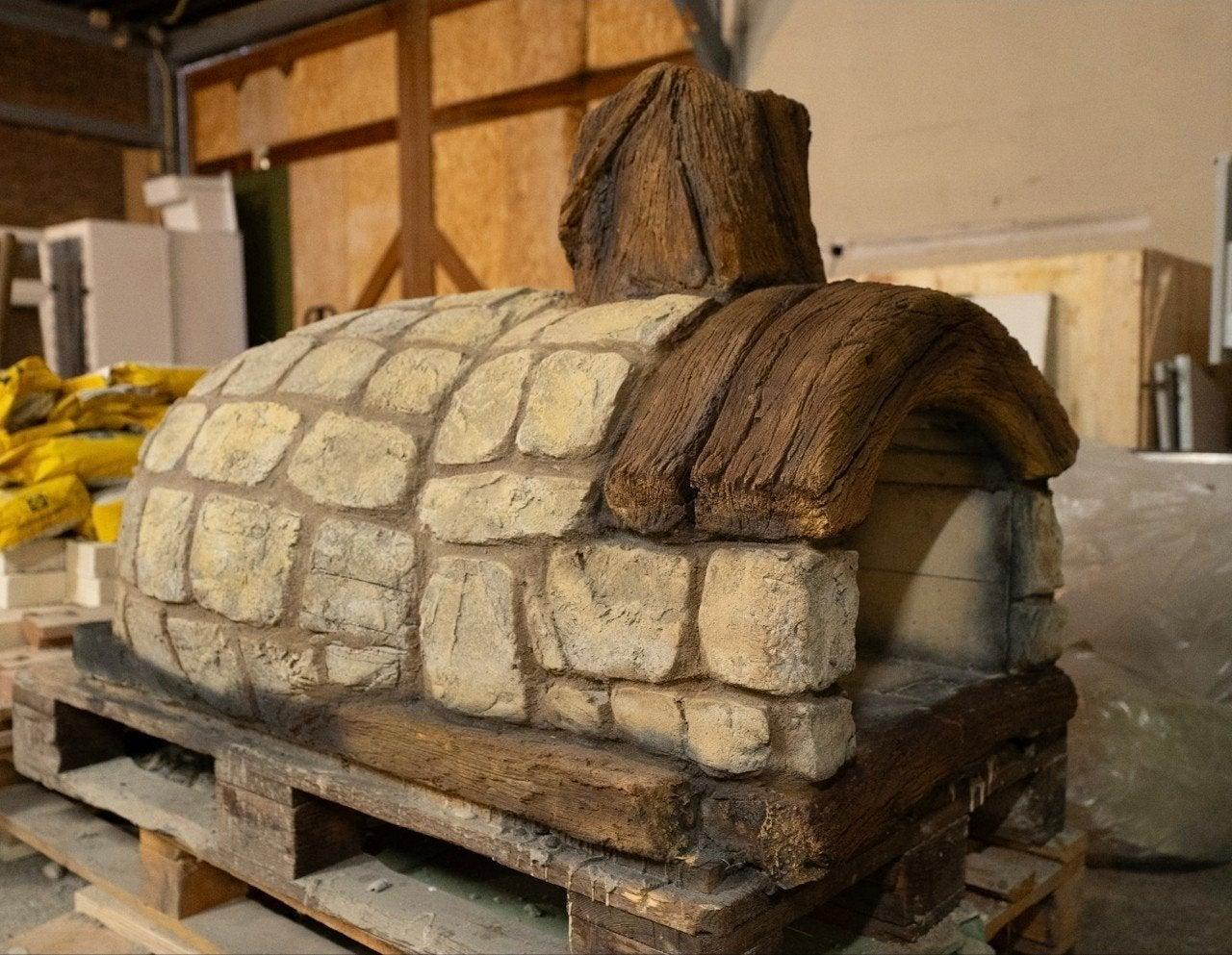 Decorative stone oven model with wooden roof and chimney